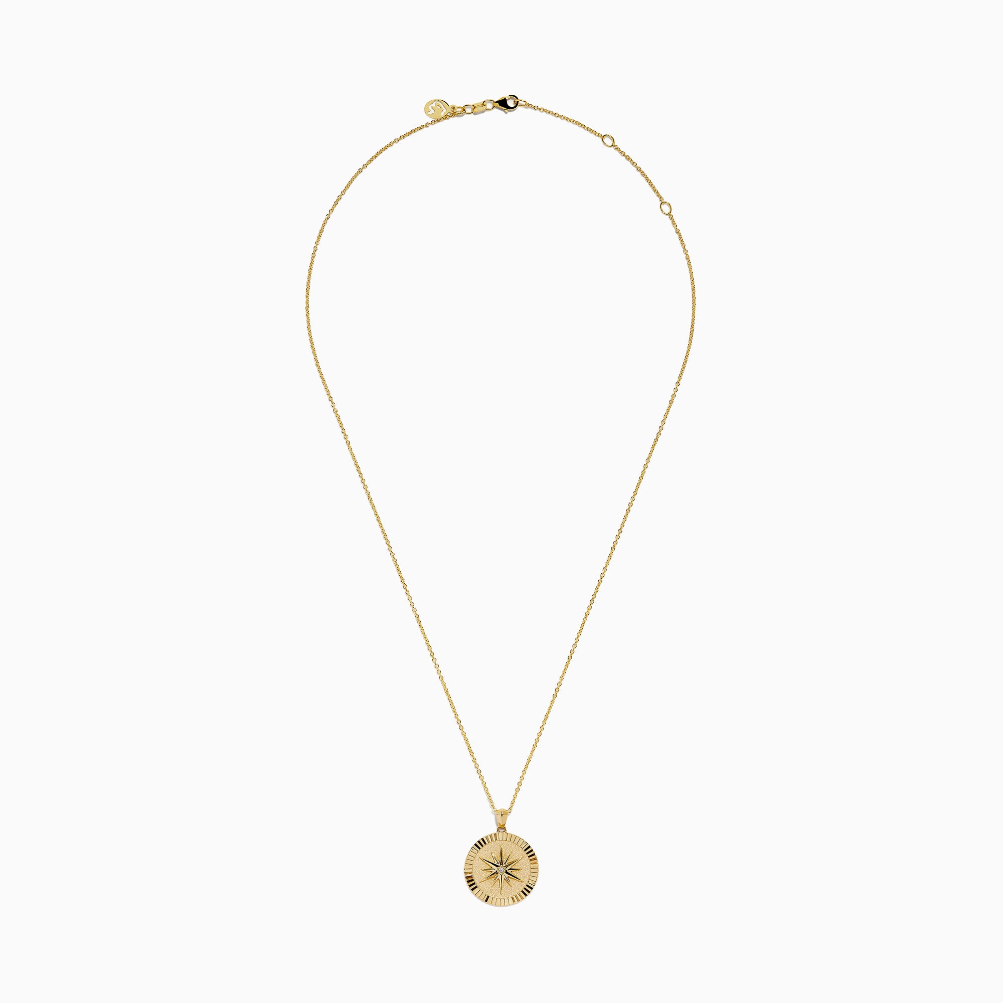 The D'Oro 14K Yellow Gold Diamond Compass Coin Pendant features a round medallion with a compass-inspired design, accented by a diamond at the center and suspended from a delicate yellow gold chain.
