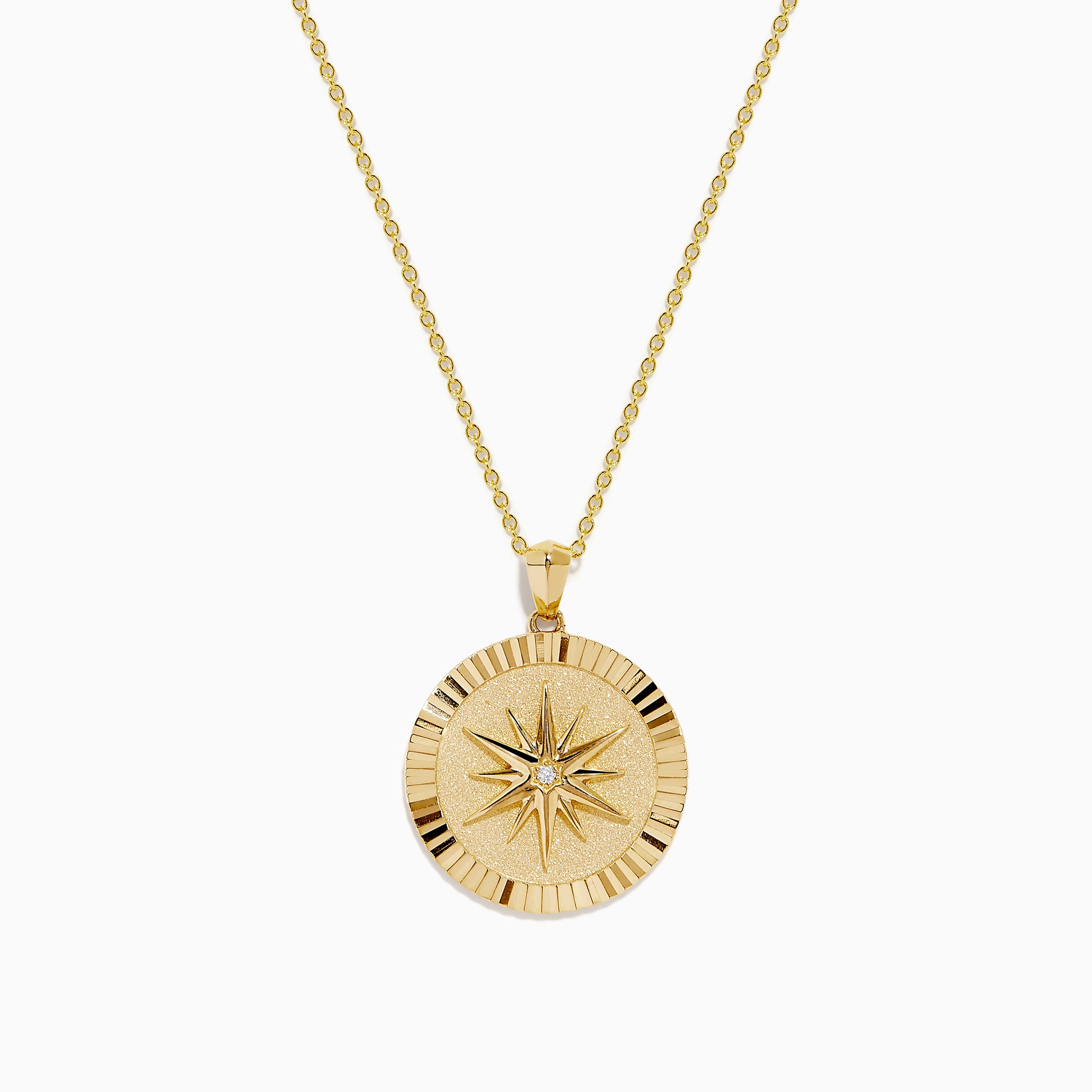 The D'Oro 14K Yellow Gold Diamond Compass Coin Pendant features a round medallion with a compass-inspired design, accented by a diamond at the center and suspended from a delicate yellow gold chain.