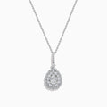 A 14K White Gold Diamond Pear Cluster Pendant featuring a delicate chain and a teardrop-shaped pendant adorned with sparkling diamonds in a floral pattern.