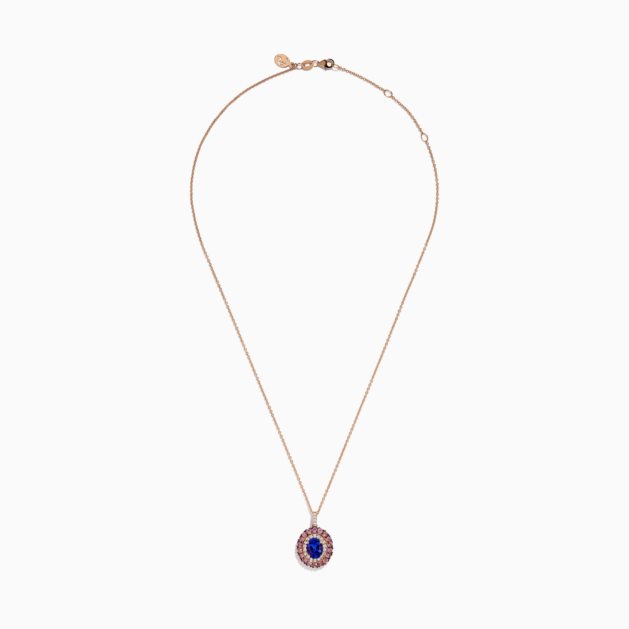 The 14K Rose Gold Pink Sapphire, Tanzanite, and Diamond Double Halo Pendant features an oval-shaped blue gemstone surrounded by pink sapphires, tanzanite, and diamonds on a delicate 14K rose gold chain attached at the top.