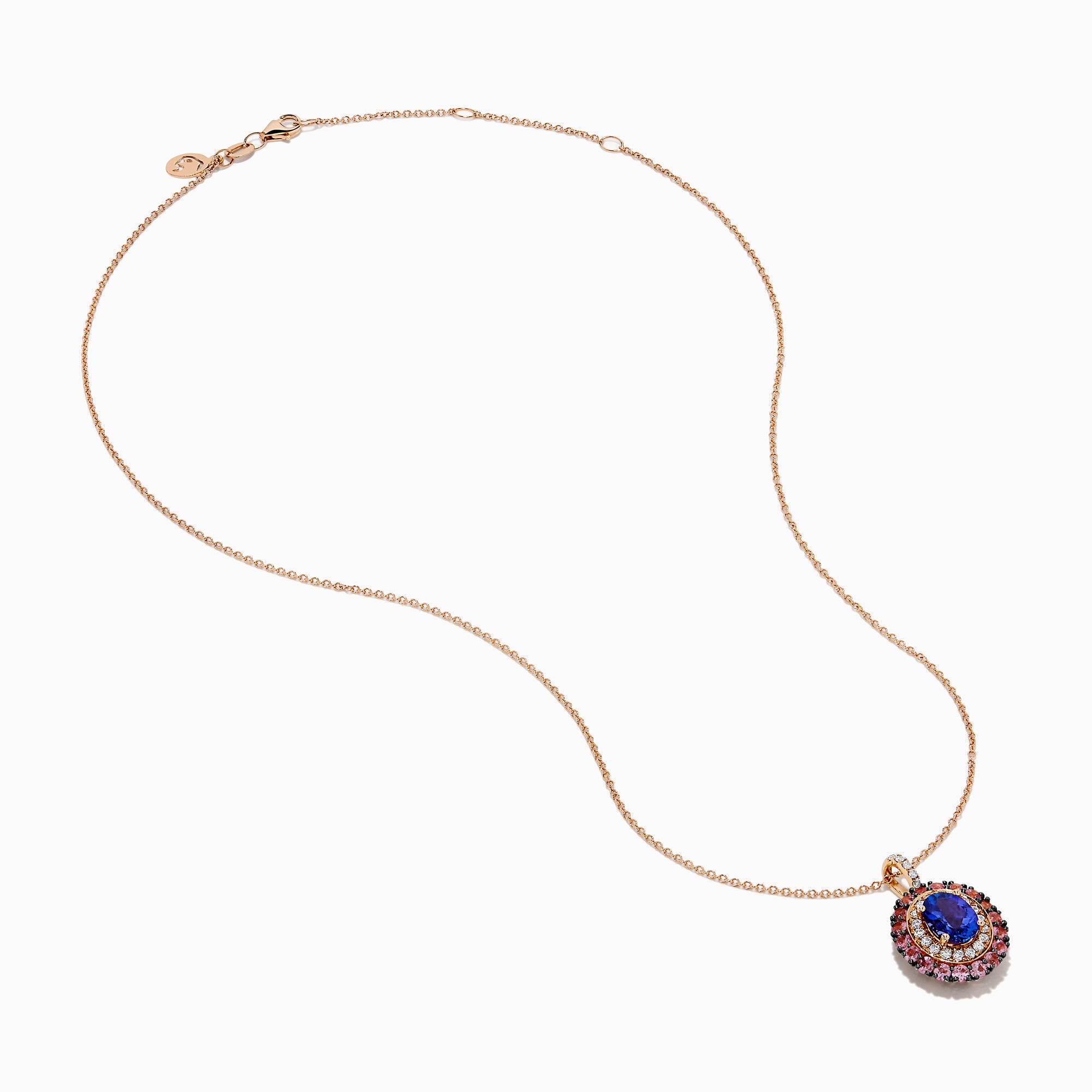 The 14K Rose Gold Pink Sapphire, Tanzanite, and Diamond Double Halo Pendant features an oval-shaped blue gemstone surrounded by pink sapphires, tanzanite, and diamonds on a delicate 14K rose gold chain attached at the top.