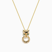 The Signature 14K Yellow Gold Tsavorite and Diamond Panther Pendant features tsavorite green eyes, black accents, and a circular ring with sparkling diamonds in the panther’s mouth.