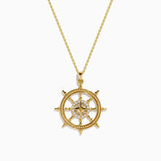 The 14K Yellow Gold Diamond Ship's Wheel Pendant features a ship’s wheel design, accented with sparkling diamonds set symmetrically along the spokes.