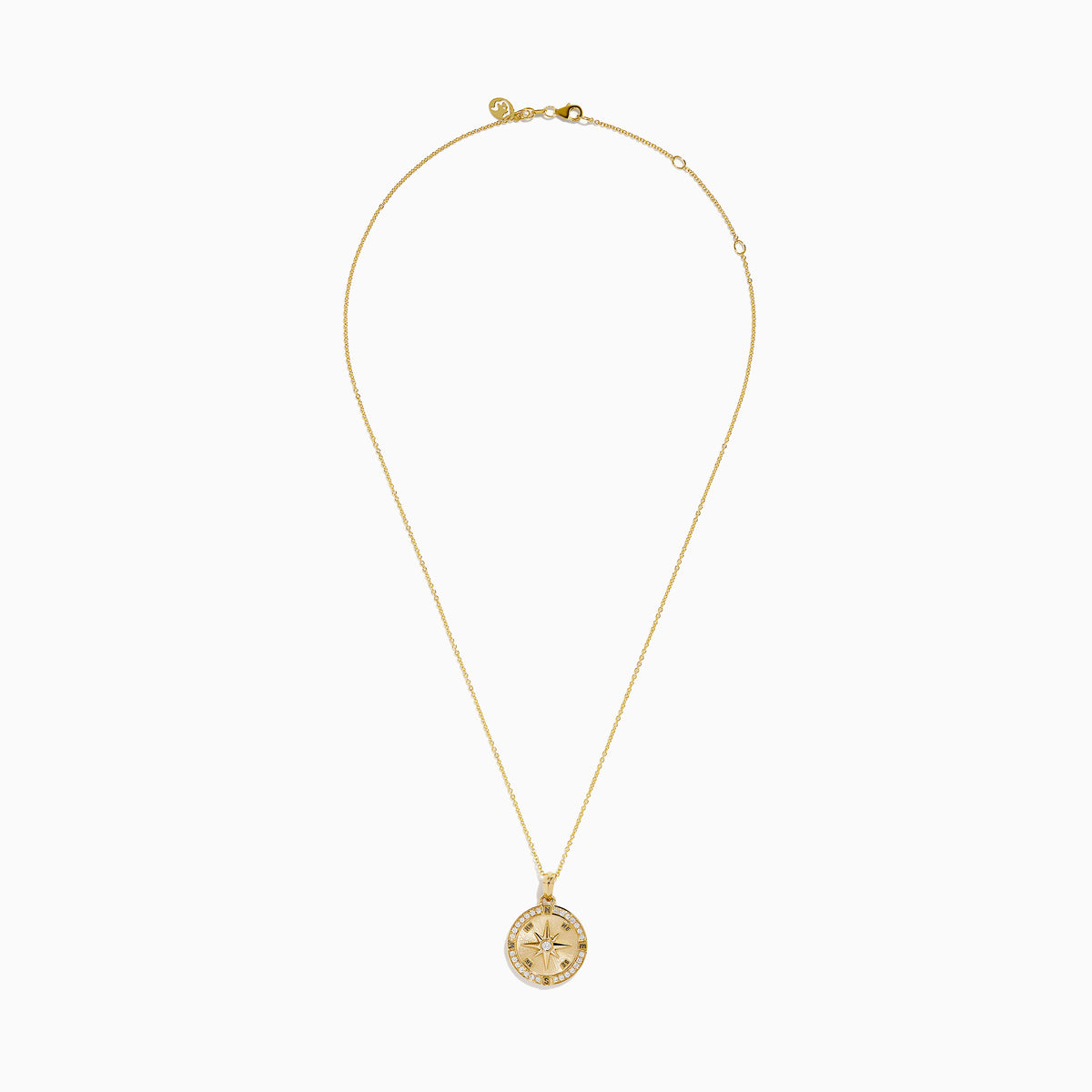 The 14K Yellow Gold Diamond Compass Rose Medallion Pendant features a round diamond compass design with a central gemstone and sparkling border, elegantly suspended from a delicate gold chain.