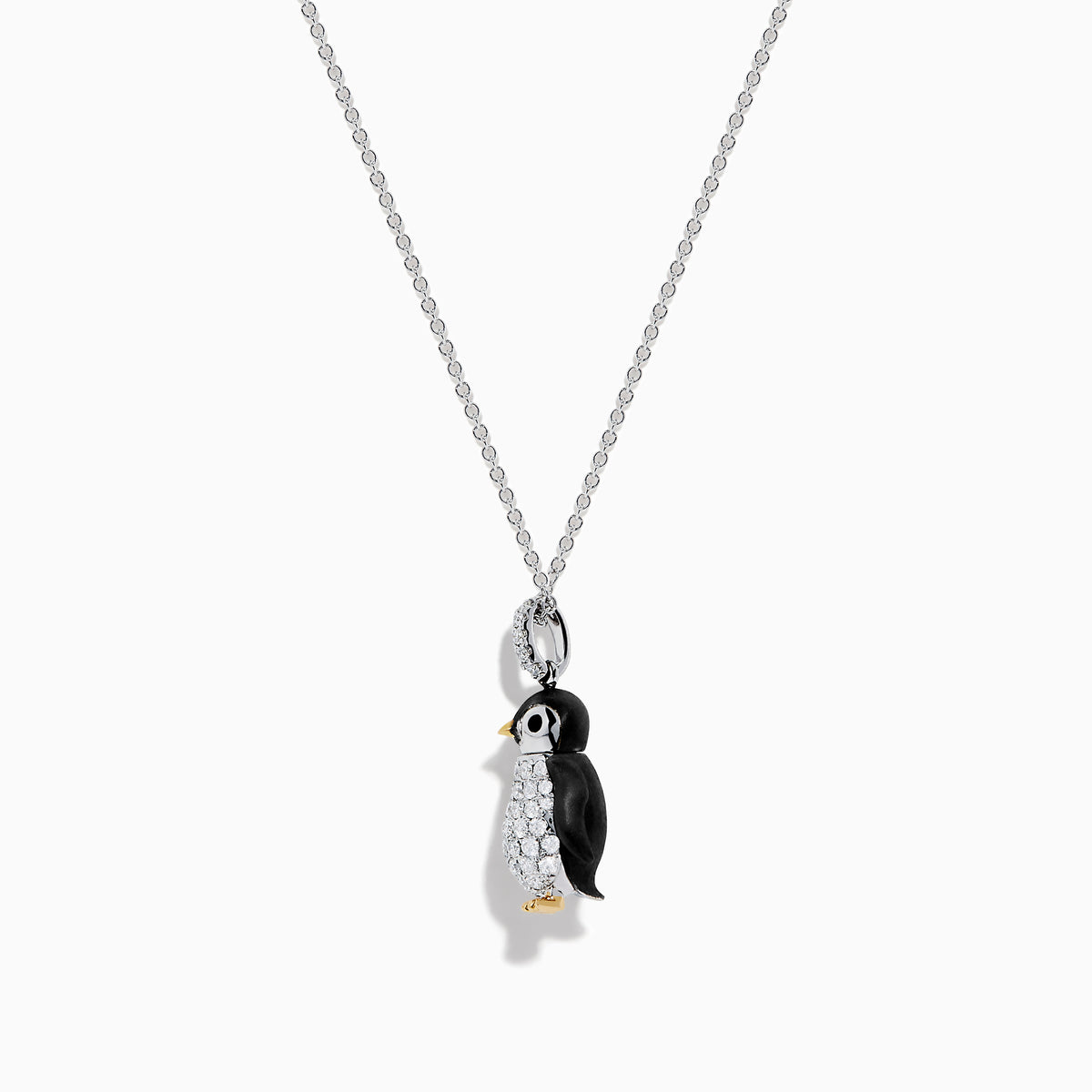 The Seaside 14K Two Tone Gold Diamond Penguin Pendant features black, white, and gold accents with sparkling diamond details for a charming look. Photographed against a plain white background.