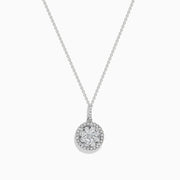 Bouquet 14K White Gold Diamond Cluster Pendant 1.04 TCW displayed on a silver chain, featuring sparkling diamonds in a round cluster with a halo, set in 14K white gold against a plain white background.