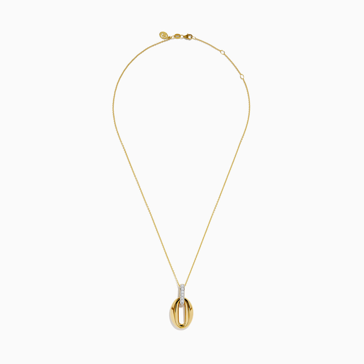 The 14K Yellow Gold Sculptural Oval Drop Pendant with Diamond Accents features an elegant oval design on a delicate chain, showcasing diamonds set in white metal at the top against a white background.