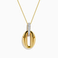 The 14K Yellow Gold Sculptural Oval Drop Pendant with Diamond Accents features an elegant oval design on a delicate chain, showcasing diamonds set in white metal at the top against a white background.