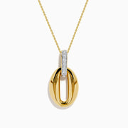 The 14K Yellow Gold Sculptural Oval Drop Pendant with Diamond Accents features an elegant oval design on a delicate chain, showcasing diamonds set in white metal at the top against a white background.