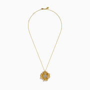 The D'Oro 14K Yellow Gold Diamond Flower Pendant features textured petals and clusters of sparkling diamonds at the center and edges, suspended from a delicate gold chain.