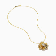 The D'Oro 14K Yellow Gold Diamond Flower Pendant features textured petals and clusters of sparkling diamonds at the center and edges, suspended from a delicate gold chain.
