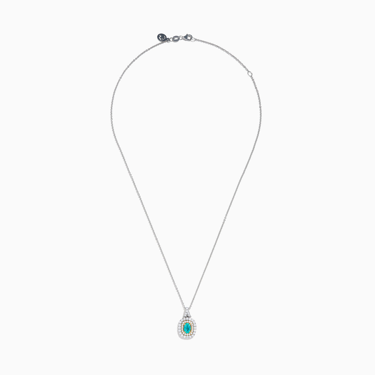The 18K Two Tone Gold Paraiba and Diamond Double Halo Pendant showcases an oval Paraiba centerpiece, surrounded by a halo of yellow stones and a second halo of sparkling diamonds.