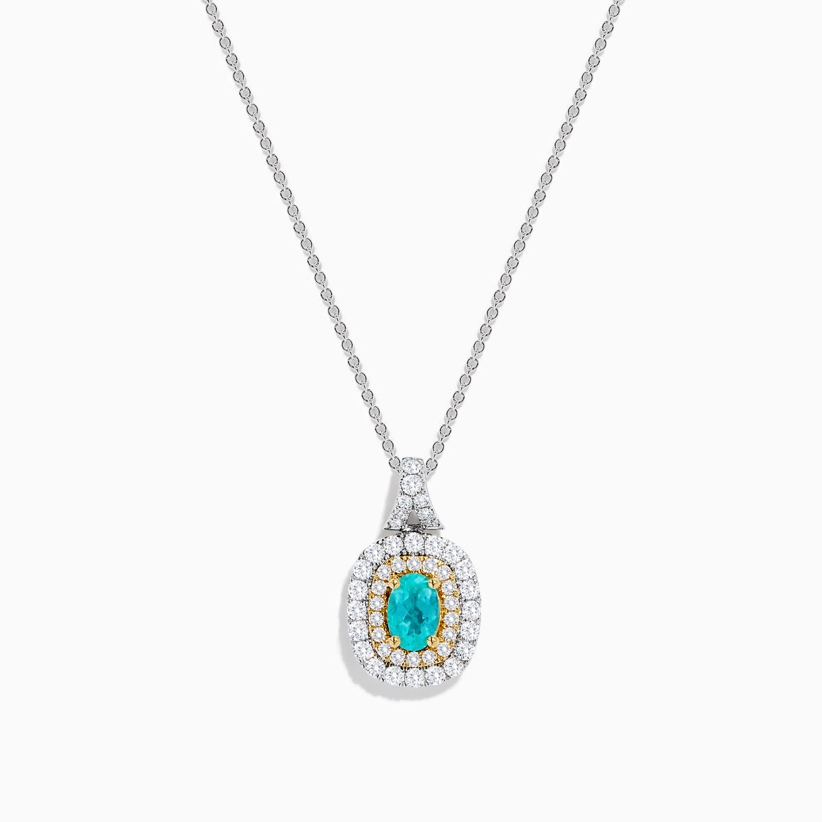 The 18K Two Tone Gold Paraiba and Diamond Double Halo Pendant showcases an oval Paraiba centerpiece, surrounded by a halo of yellow stones and a second halo of sparkling diamonds.