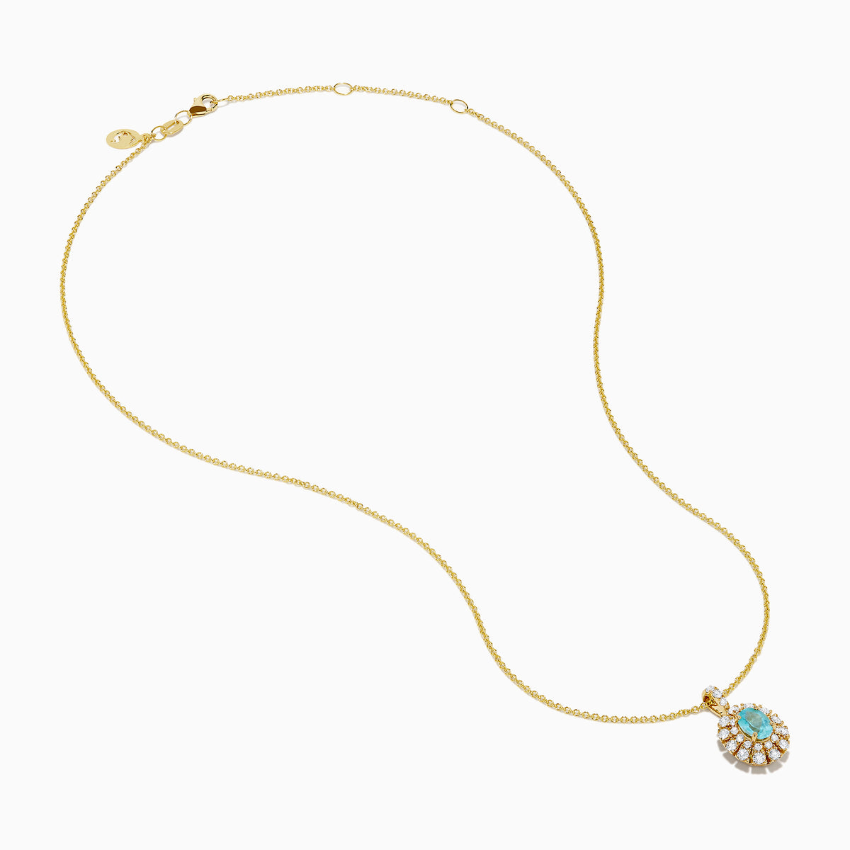 The 18K Yellow Gold Paraiba and Diamond Pendant features an oval turquoise Paraiba gemstone accented by a halo of sparkling diamonds, showcased against a white background.