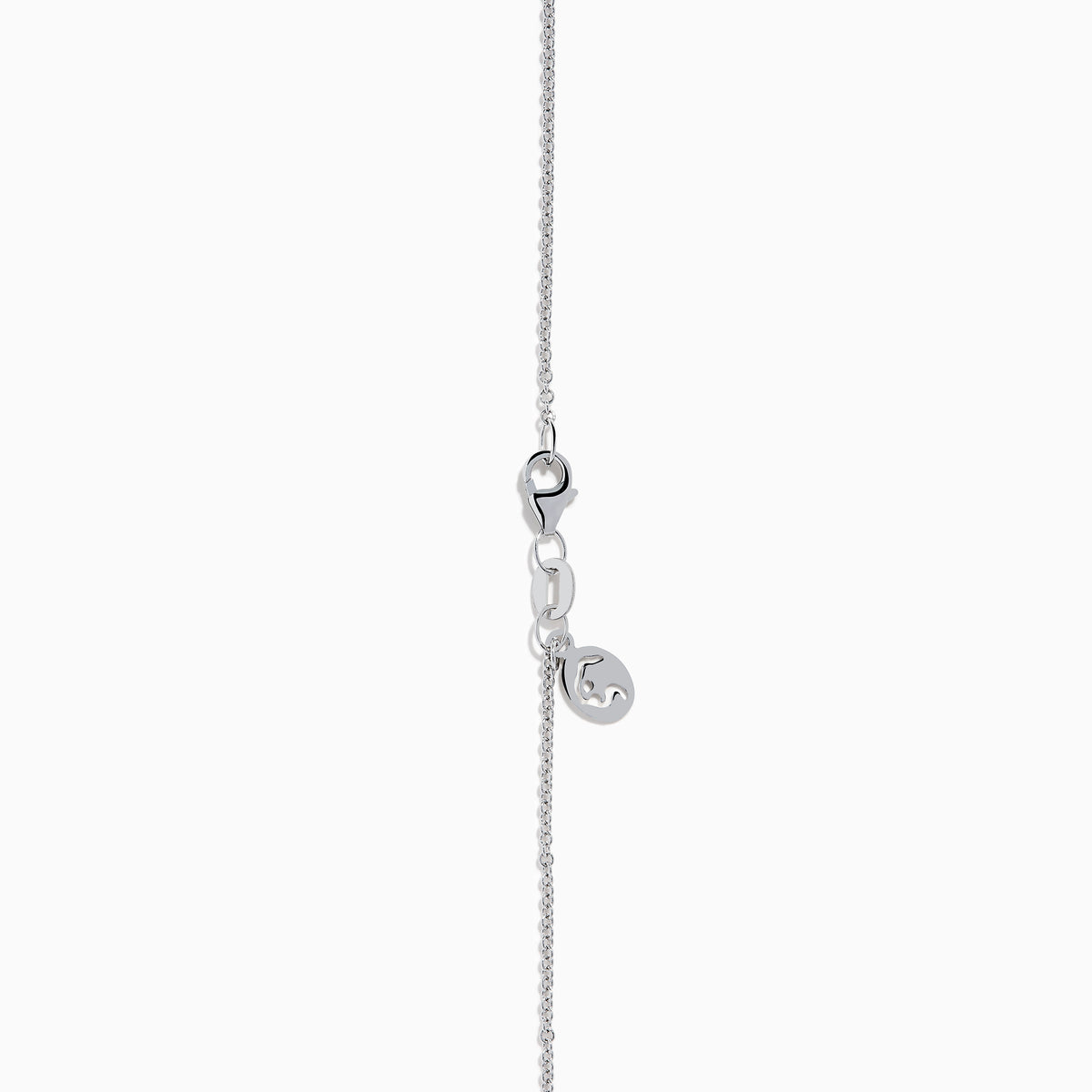 An 18K White Gold Paraiba and Diamond Pendant with an oval Paraiba gemstone and a halo of diamonds hangs from a delicate chain, shown against a plain white background.