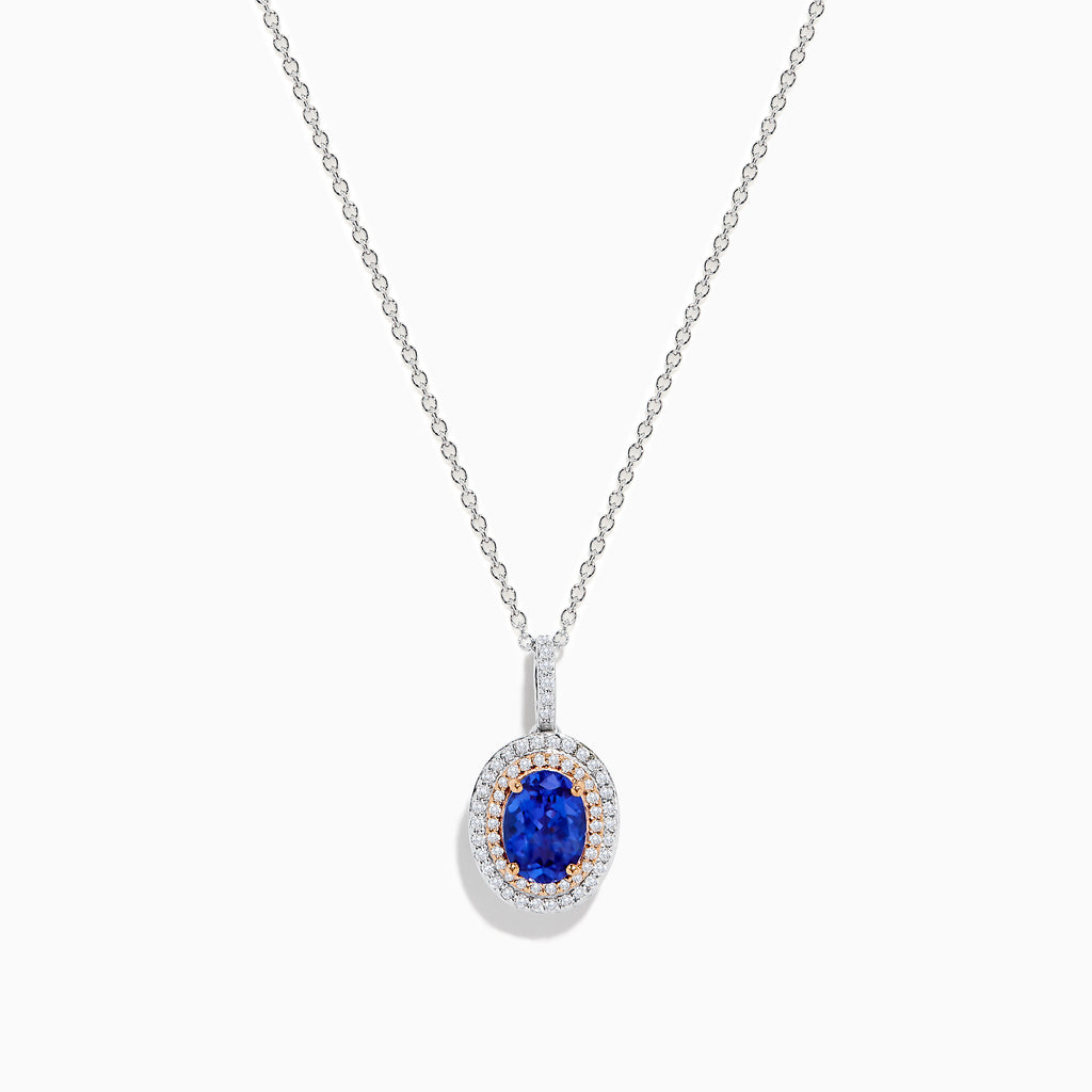 The Nahla Siri 14K White & Rose Gold Tanzanite and Diamond Pendant features an oval tanzanite surrounded by a double halo of diamonds, all set on a delicate silver chain and photographed against a white background.