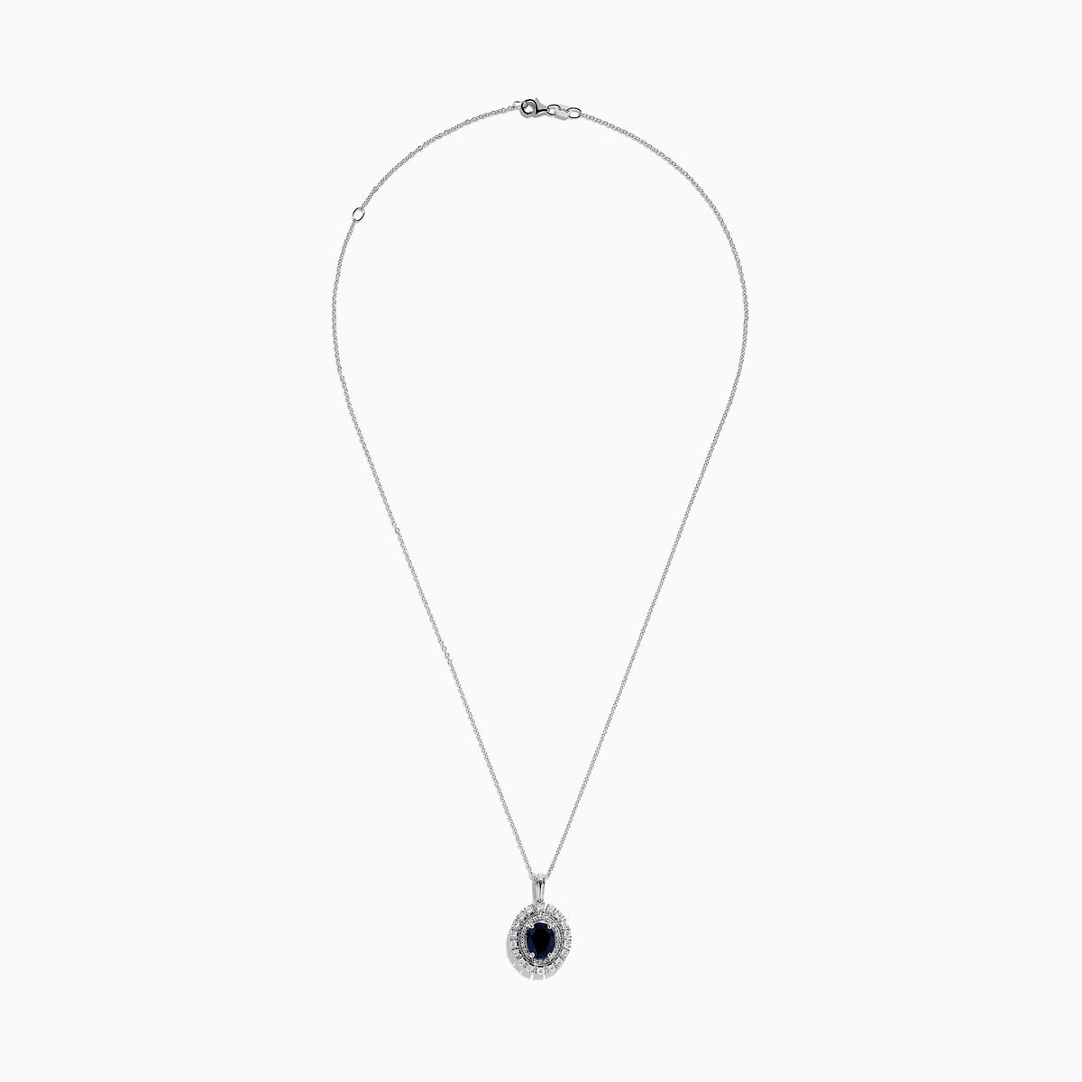 The Royal Bleu 14K White Gold Sapphire & Diamond Halo Pendant features a vibrant sapphire framed by two rows of sparkling white diamonds, all set in a chain necklace against a plain white background.