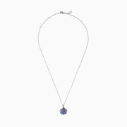 The Seaside 925 Silver Tanzanite and Diamond Seashell Pendant features five round blue tanzanite gemstones in a teardrop design, accented by a row of sparkling diamonds on the pendant’s bail.