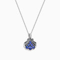 The Seaside 925 Silver Tanzanite and Diamond Seashell Pendant features five round blue tanzanite gemstones in a teardrop design, accented by a row of sparkling diamonds on the pendant’s bail.