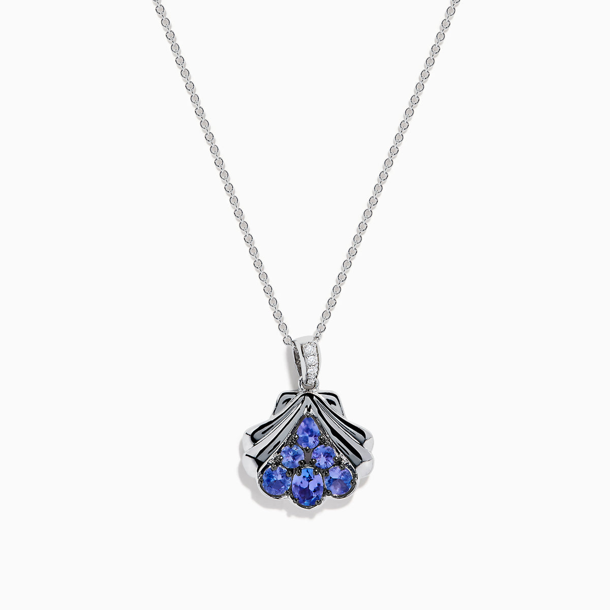 The Seaside 925 Silver Tanzanite and Diamond Seashell Pendant features five round blue tanzanite gemstones in a teardrop design, accented by a row of sparkling diamonds on the pendant’s bail.