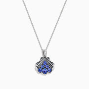 The Seaside 925 Silver Tanzanite and Diamond Seashell Pendant features five round blue tanzanite gemstones in a teardrop design, accented by a row of sparkling diamonds on the pendant’s bail.