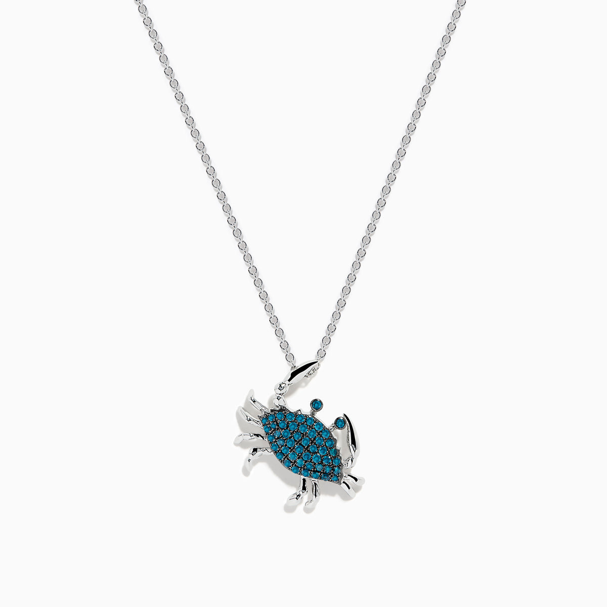 The Seaside 14K White Gold Blue Diamond Crab Pendant features sparkling blue diamonds on its shell, crafted in elegant white gold and shown against a plain white background.