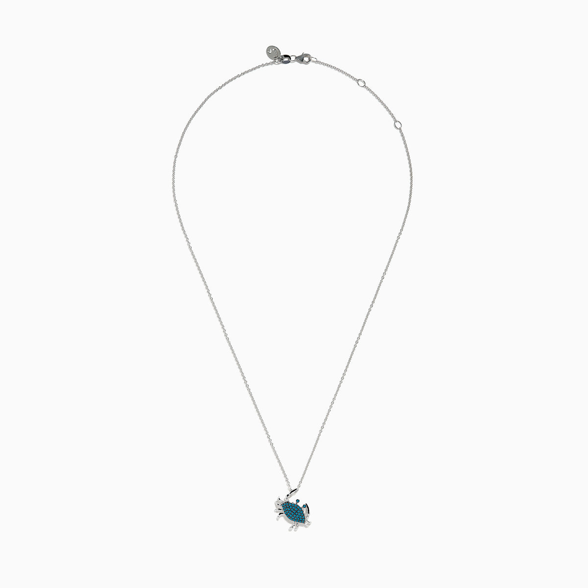 The Seaside 14K White Gold Blue Diamond Crab Pendant features sparkling blue diamonds on its shell, crafted in elegant white gold and shown against a plain white background.