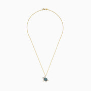 The Seaside 14K Yellow Gold Blue and White Diamond Turtle Pendant features sparkling blue and white diamonds on the shell, head, and flippers of a turtle, set on a gold chain against a plain white background.
