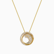 The D'Oro 14K Yellow Gold Diamond Swirl Pendant features a circular design with two intertwined loops—one in polished gold, the other adorned with sparkling diamonds.
