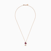 A 14K rose gold pendant featuring two butterfly charms—one with pink sapphire and purple gemstones, the other with sparkling diamonds—displayed on a white background.