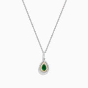 The Brasilica 14K White & Yellow Gold Emerald and Diamond Pendant features a teardrop-shaped emerald framed by double halos of white and yellow diamonds on a silver chain.
