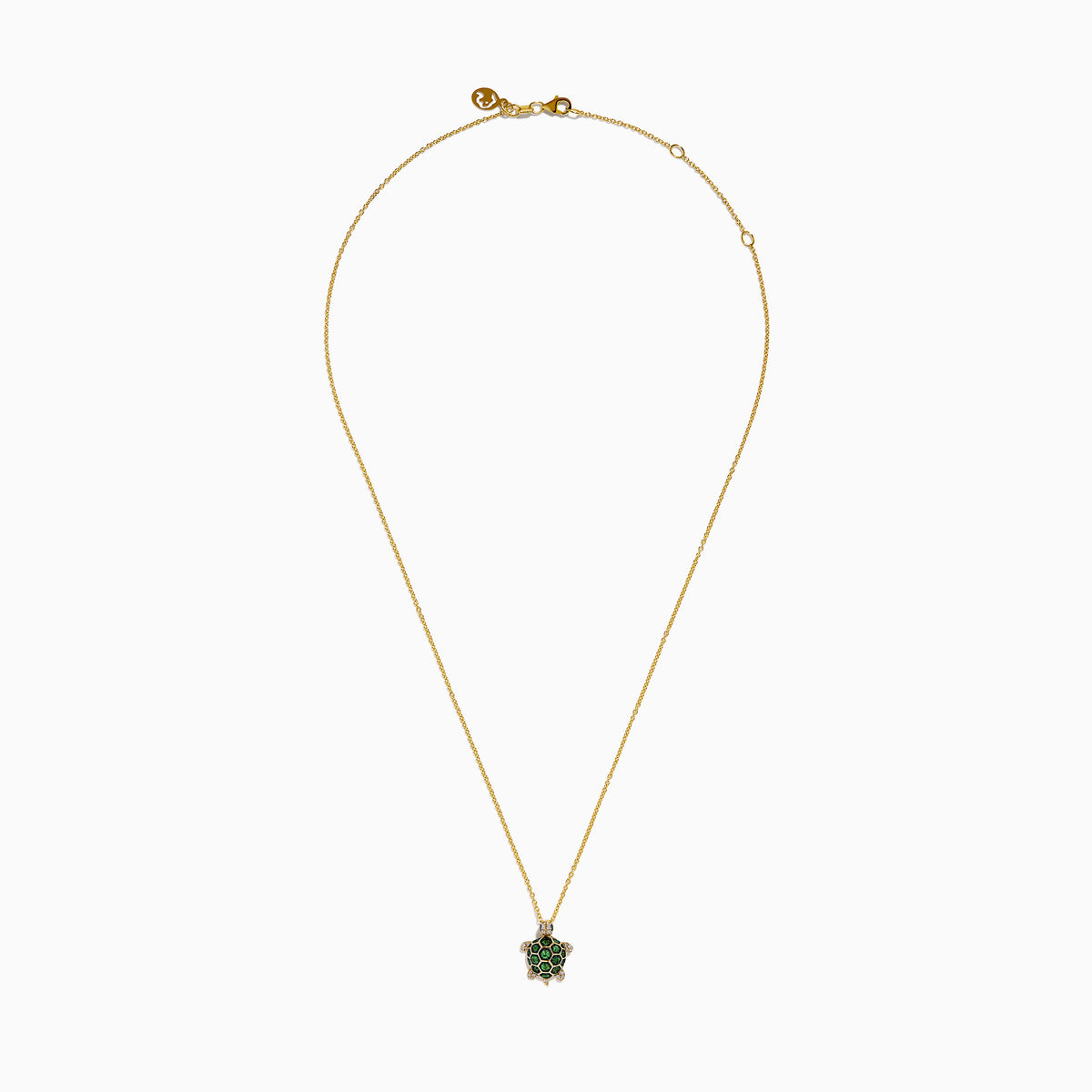 The 14K Yellow Gold Tsavorite and Diamond Turtle Pendant features a turtle-shaped design with a shell adorned in vibrant green tsavorites and sparkling diamonds on its head and feet, set against a plain white background.