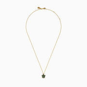 The 14K Yellow Gold Tsavorite and Diamond Turtle Pendant features a turtle-shaped design with a shell adorned in vibrant green tsavorites and sparkling diamonds on its head and feet, set against a plain white background.