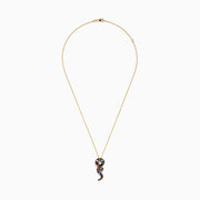 The Safari 14K Yellow Gold Multi Sapphire and Diamond Snake Pendant hangs on a gold chain, featuring sparkling sapphires and a diamond snake design against a plain white background.