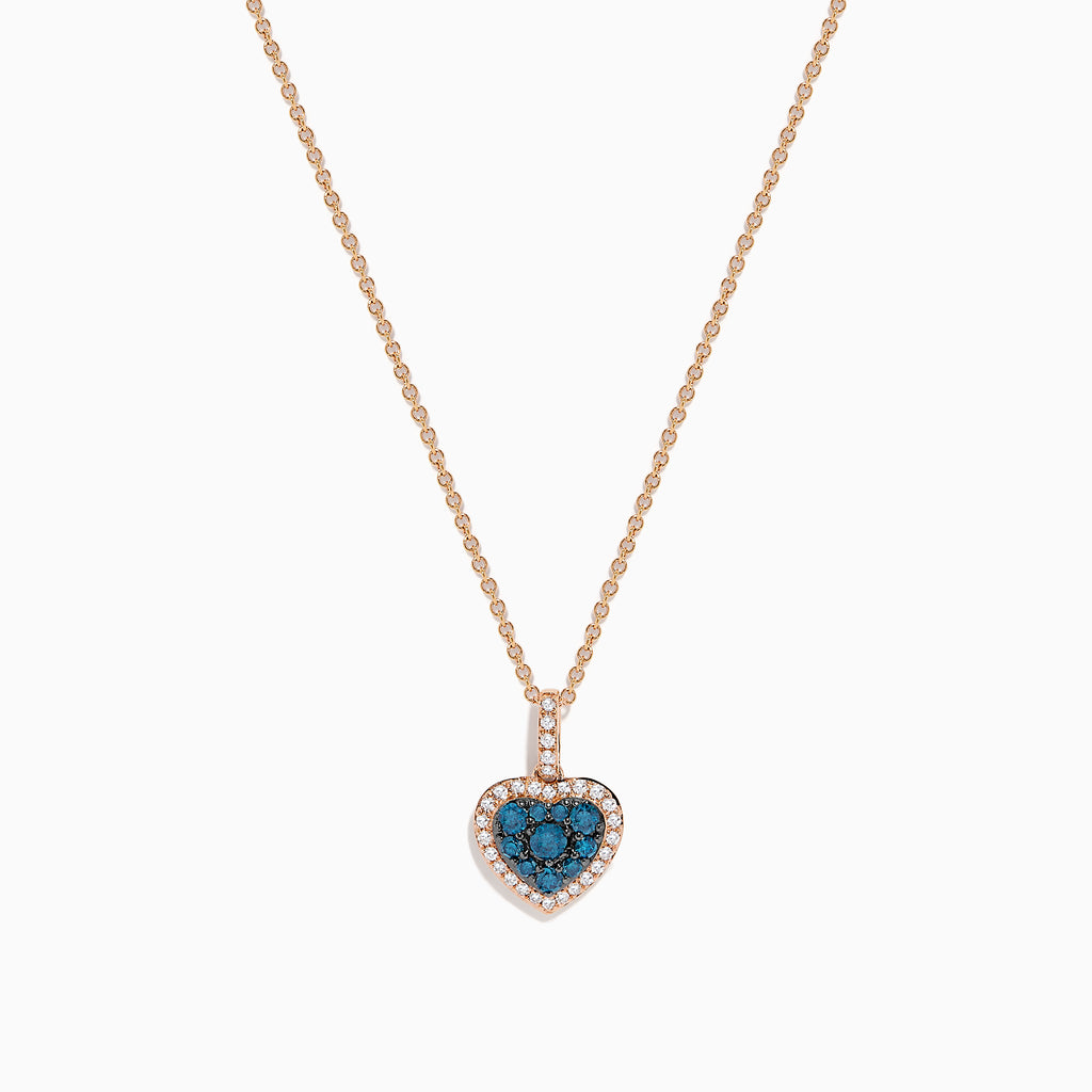 The Bella Bleu 14K Rose Gold Blue and White Diamond Heart Pendant features a heart-shaped design with blue diamonds at the center, bordered by white diamonds, hanging vertically on a rose gold chain against a white background.