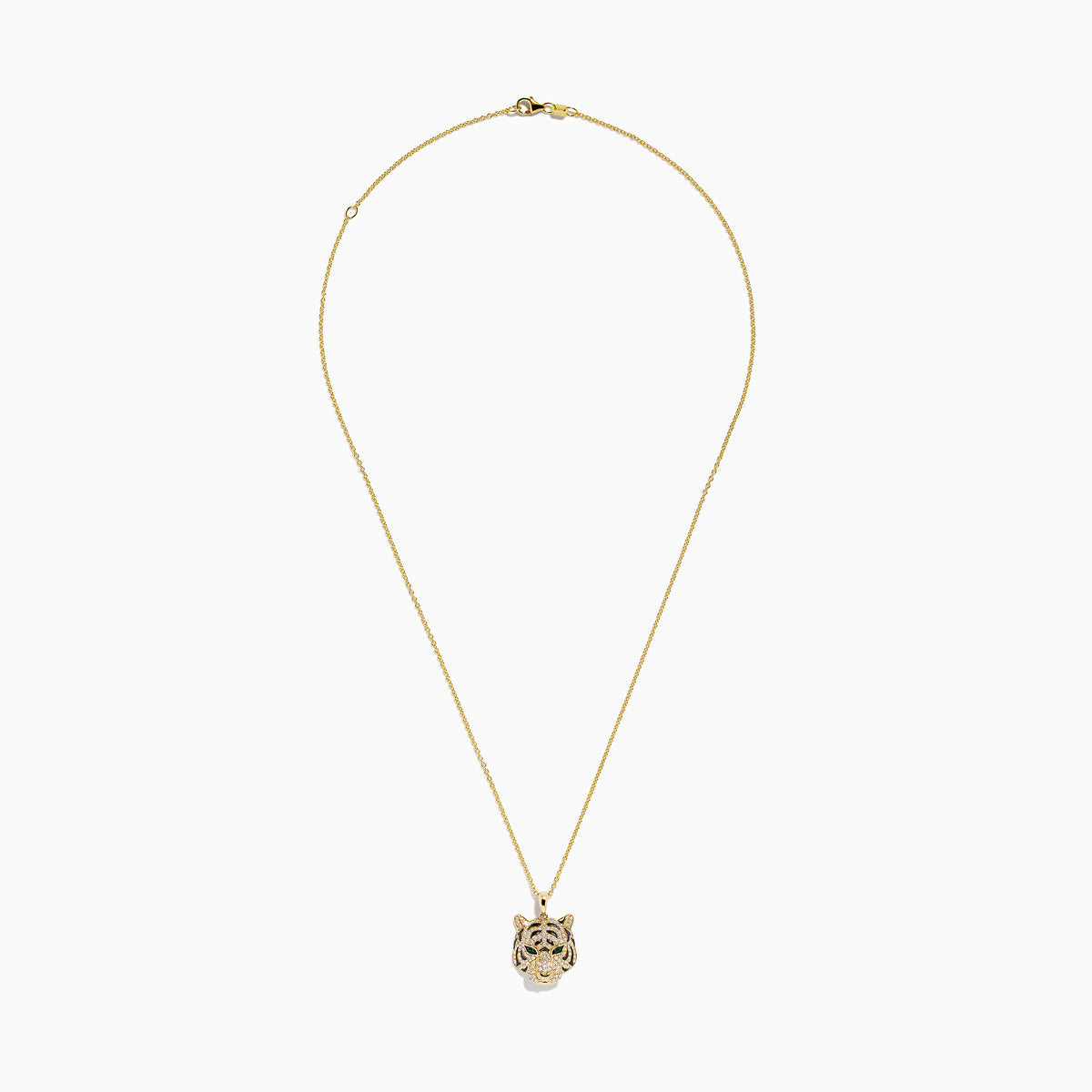 The Safari 14K Yellow Gold Diamond and Emerald Tiger Pendant features a tiger’s head with clear stones and green gemstone eyes, displayed on a white background.