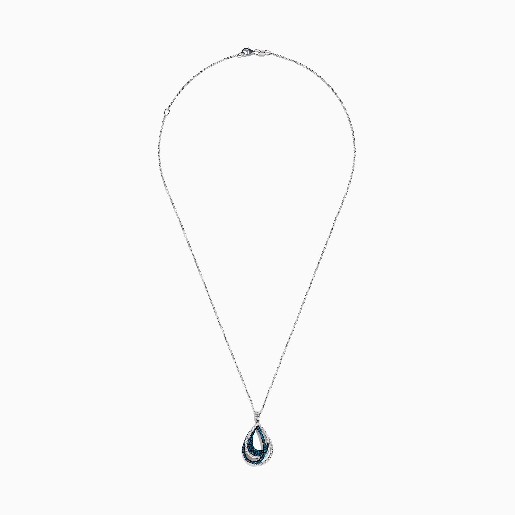 The 14K White Gold Blue and White Diamond Pear Crossover Pendant features blue and white diamonds in a swirling pattern, set on a delicate chain for a modern, intricate look.