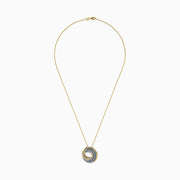 A 14K Yellow Gold Blue and White Diamond Circle Pendant with intertwined loops of gold, silver, and blue pavé-set stones in a swirling design reminiscent of an elegant Blue Diamond Pendant.