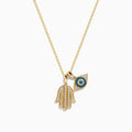 The Novelty 14K Yellow Gold White and Blue Diamond Hamsa & Evil Eye Pendant pairs a diamond Hamsa hand with a blue and white evil eye, both hanging from a delicate yellow gold chain.