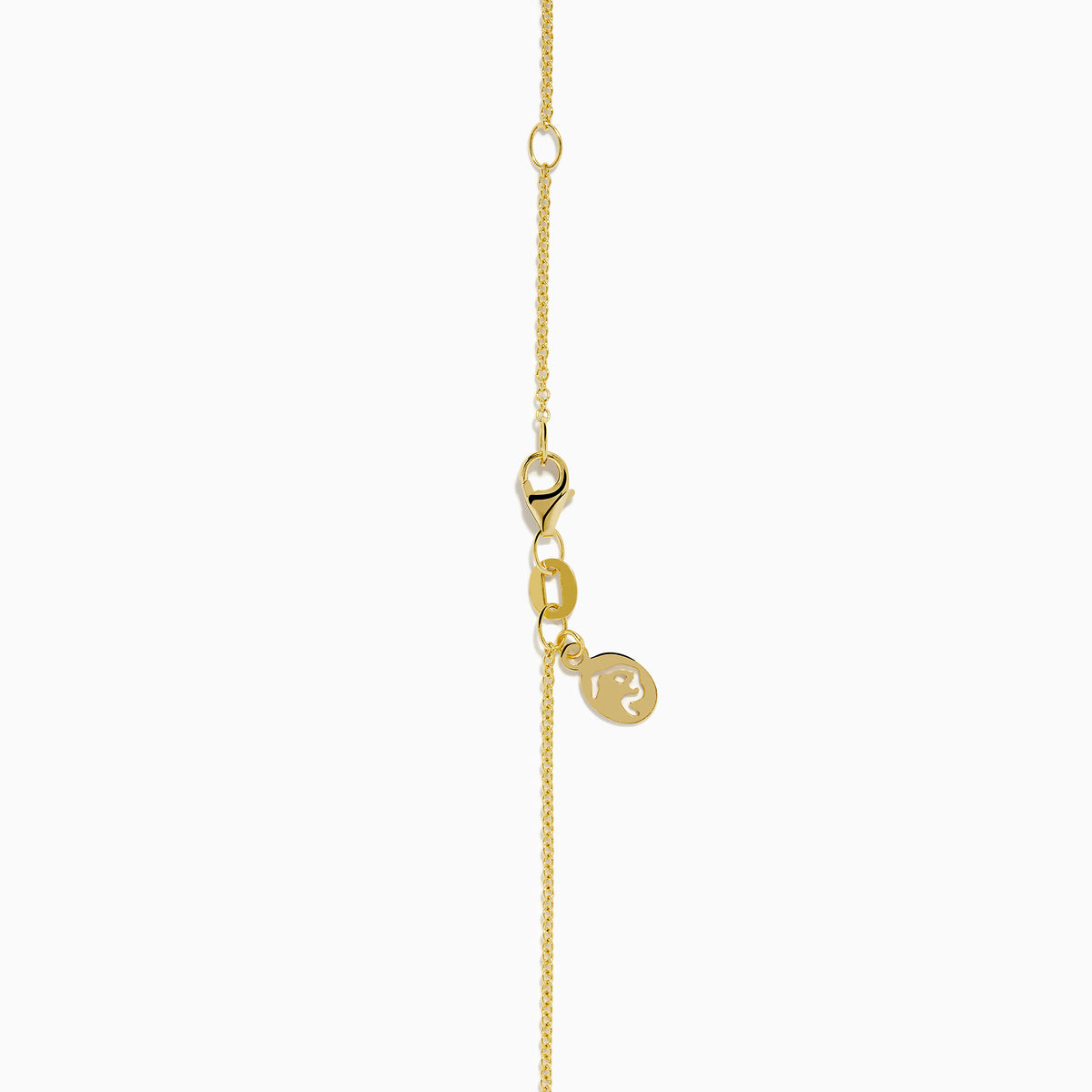 The Signature 14K Yellow Gold Diamond and Emerald Panther Pendant features a panther’s head with green gemstone eyes, black enamel detail, and a diamond-studded ring held in its mouth.