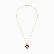 The Signature 14K Yellow Gold Multi Sapphire Diamond Pendant features interlocking rings—one plain gold, the other adorned with sparkling multi sapphires and diamonds in a vibrant leopard print, capturing Effy’s signature bold style.
