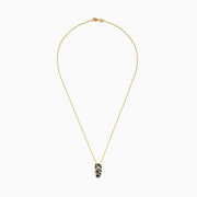 A 14K Yellow Gold Flip Flop Pendant featuring white, brown, and black diamonds with a striking leopard print design and sparkling accents on the straps.