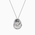 The 14K White Gold Diamond Overlapping Circle Pendant features three intertwined loops, two adorned with sparkling diamonds, suspended from a fine chain against a white background.