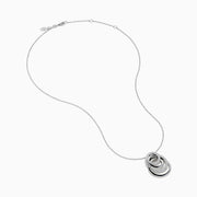 The 14K White Gold Diamond Overlapping Circle Pendant features three intertwined loops, two adorned with sparkling diamonds, suspended from a fine chain against a white background.