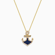 The Seaside 14K Yellow Gold Blue Sapphire and Diamond Anchor Pendant features a yellow gold necklace with sparkling blue sapphires and diamonds, showcased against a white background.