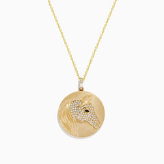 The Safari 14K Yellow Gold White and Black Diamond Horse Pendant features a round design with a horse’s head, accented by sparkling white and black diamonds for an elegant, detailed look.