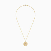 The Safari 14K Yellow Gold White and Black Diamond Horse Pendant features a round design with a horse’s head, accented by sparkling white and black diamonds for an elegant, detailed look.