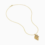 The Novelty 14K Yellow Gold White and Black Diamond Horse Pendant showcases a horse’s head with a detailed mane and sparkling diamond accents, elegantly displayed on a plain white background.