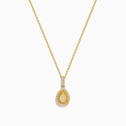 The Canare 14K Yellow Gold White and Yellow Diamond Pendant features a teardrop-shaped yellow diamond framed by two rows of white stones on a gold chain, shown on a white background.