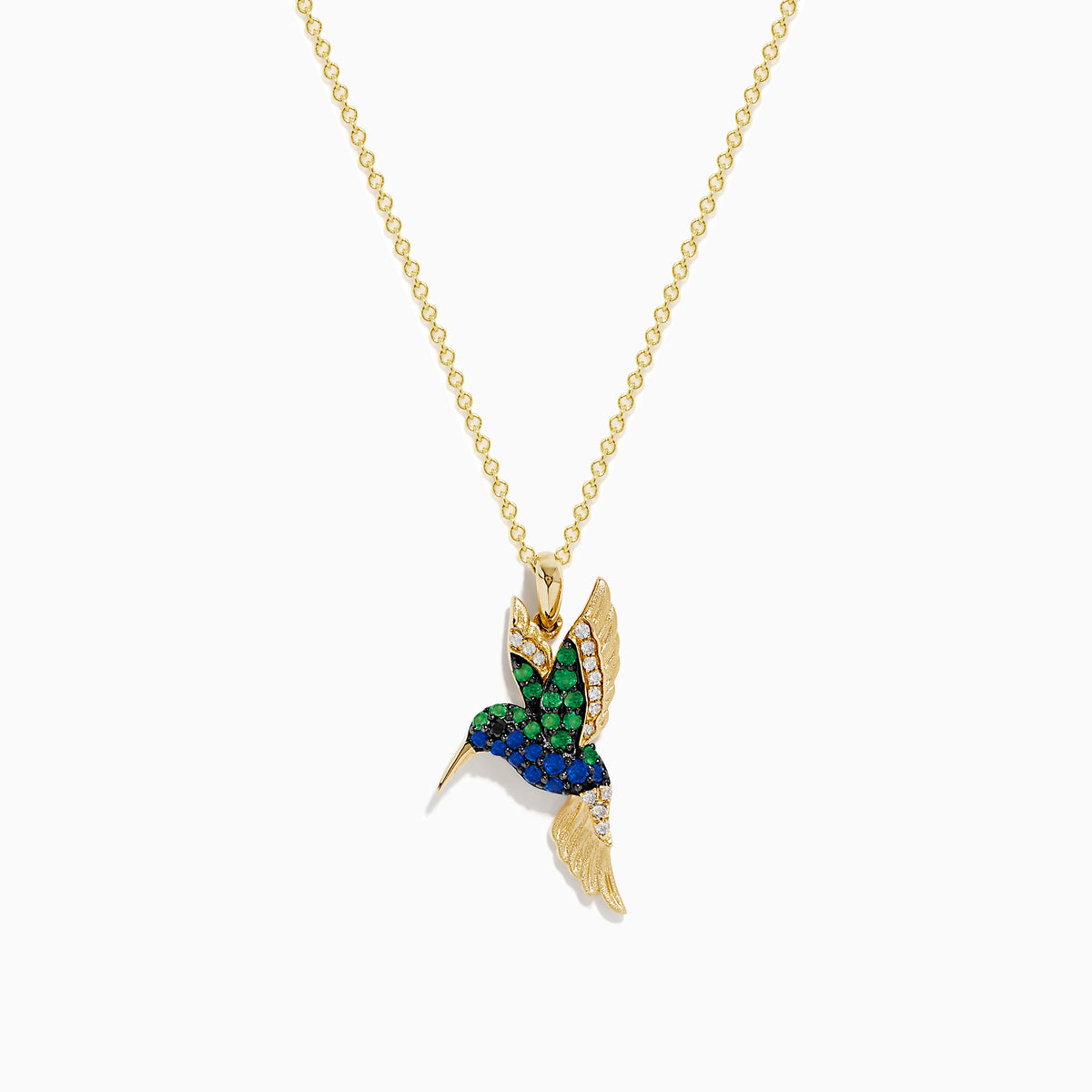 The Safari 14k Yellow Gold Emerald and Sapphire Humming Bird Pendant features a hummingbird-shaped design with emerald and sapphire accents, shown against a white background.